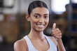 Portrait, woman and thumbs up in gym for wellness, happy and athlete for health goal in fitness club. Sports, training and smile for exercise or challenge activity, done and excited for achievement