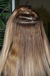 Hot hair extensions on microcapsules. Italian hair extension technology.