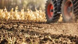 Fototapeta Konie - Closeup of tractor and planter in farm field planting corn or soybeans seed in dry, dusty soil during spring season