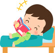 ベッドに寝転んで漫画を読むパジャマ姿の男の子