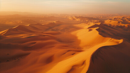 Wall Mural - Colorful sunset over majestic sand dunes, vast desert aerial landscape with mountains in the background