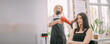 © Anna - Professional hairdresser woman in an apron makes a hairstyle with a hair dryer to a young girl in a beauty salon.