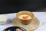Fototapeta Tulipany - Steamed egg with garlic on white table. Thai street food restaurant menu. Home cooking concept.