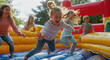 © Kien - A group of children are having fun on an inflatable bouncy castle in the sun