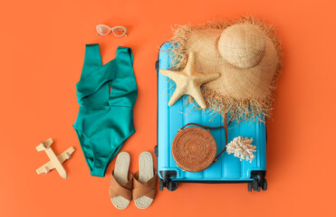 Sticker - Composition with suitcase, stylish female swimsuit and beach accessories on color background