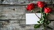 A white blank greeting card featuring vibrant red roses against a rustic wooden backdrop leaving a space for your personalized message