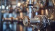 Defocused gears and pipes create a mesmerizing backdrop in this shot of the brewing systems inner workings. .