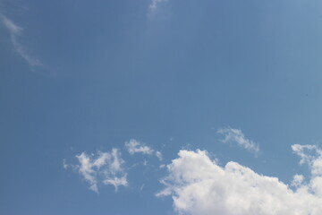 blue sky and white clouds. Freshness of the new day. Bright blue background. Relaxing feeling like being in the sky.