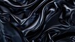 Glossy silk drape in dark wavy form with wrinkled fabric