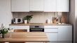 © Faheem - Kitchen with cooking stove, oven and table. Cabinet design in small home. Electric ceramic induction cooker. Contemporary scandinavian white decor and wood counter. Interior or condo apartment