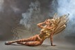Sensual lady in carnival costume sitting on floor