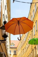 Wall Mural - A street in Vienna with suspended umbrellas