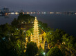Aerial drone top view of Tran Quoc temple at night in Tay Ho district