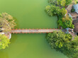 Aerial drone top view of The Huc (Red) bridge on Hoan Kiem lake, Hanoi city