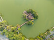 Aerial drone top view of Ngoc Son temple with The Huc bridge, Hoan Kiem lake, Hanoi city