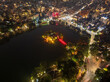 Aerial drone view of Hanoi old quarter with Hoan Kiem lake at twilight in Hoan Kiem district.