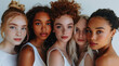 A group of beautiful women with different skin tones posing in white for the camera in a studio shot with studio light
