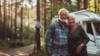 Happy senior couple in campervan in the forest.
