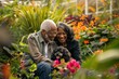 © evgenia_lo - Senior African American couple enjoying a tender moment with their dog in a vibrant flower garden.