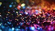 a few rainbow sparkles scattered on a mostly solid black background, abstract, glitter, magical