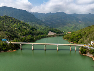 Wall Mural - Bridge over collapsed river between valleys