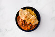 plant-based tikka masala curry with homemade naan flatbread and rice