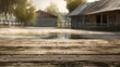 An aged wooden tabletop in sharp focus with a serene farmyard and barns in the blurred background.