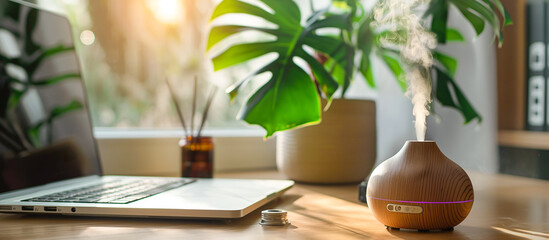 Wall Mural - a desk laptop with aromatherapy diffuser