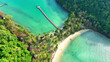 Aerial drone capture of an idyllic tropical island, Sandy beach, azure sea, and coconut trees create a breathtaking panorama. Ecotourism and biodiversity concept. Ko Ngam, Trat Province, Thailand. 
