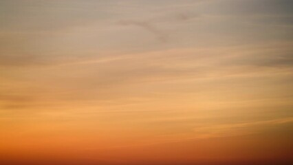 Wall Mural - The sky at dusk was painted with a gradient of red and orange clouds, abstract background time lapse