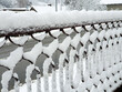 iron fence covered by fluffy snow - winter in Croatian countryside