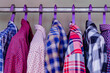 Shirts hanging on hangers in closet