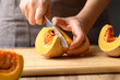 Organic pumpkin cutting on wooden board, Homemade cooking, Food ingredient