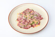 Thinly sliced pieces of beef with sauce. Beef carpaccio. A cold snack. Copy space. Isolated object.