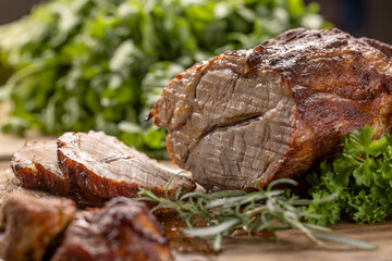 Wall Mural - Juicy whole roasted pork neck on a cutting board