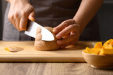 Fototapeta Kosmos - Organic pumpkin cutting on wooden board, Homemade cooking, Food ingredient