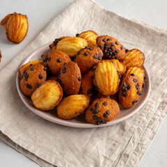 Wall Mural - Homemade French Madeleines with Chocolate Chips on a Plate, side view.