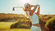 © Robert Kneschke - Graceful female golfer swinging club on a sunny day at the golf course