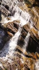 Wall Mural - Beautiful waterfall in green forest. Tropical Olu Ella Falls in mountain jungle, Sri Lanka.