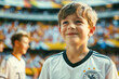 German football soccer fans in a stadium supporting the national team, little boy, Die Mannschaft
