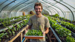 © Farnaces - Happy Young Farmer with Seedlings in a Sustainable Greenhouse