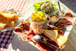 antipasti plate in Slovenia Groznjan with air dried ham cheese and fruits