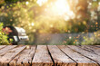 Summer time in backyard with wooden table, grill BBQ and blurred background