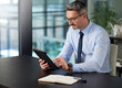 © peopleimages.com - Businessman, tablet and notebook in office typing for communication, corporate research and company information. Technology, male person and working on online plan for website, social media or sales