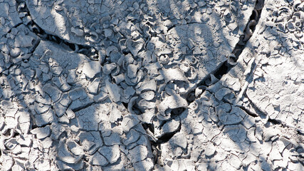 Dry cracked earth, parched land, Earth dirt texture background of brown mud, arid soil, Dry cracked earth texture, cracked earth, Dry mud, broken texture, desert, Global Warming, Climate Change.