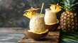 A tropical pi?+/-a colada cocktail, with creamy coconut milk, pineapple juice, and rum, blended with ice until smooth and served in a coconut shell with a slice of pineapple and a cocktail umbrella.