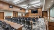 © Art AI Gallery - A large auditorium with a black and white projector screen