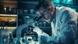 © Cassova - A focused scientist in a lab coat closely examines specimens under a microscope in a modern laboratory environment.