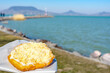 typical hungarian lake Balaton food langos with lake background in Fonyod