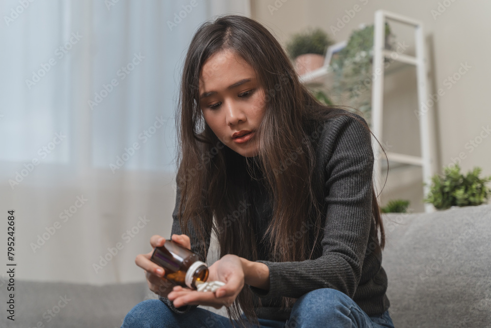Anti drug, drug addict asian young woman, girl hand reaching for syringe, medicament with narcotic on table at home, abuse overdose. Sick pain of health, unhealthy people. Suicide depressed or despair